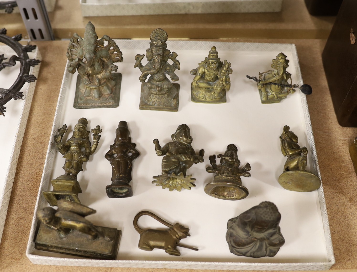 Assorted bronze and cast metal deities, largest 18 cms high